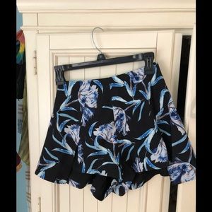 Black shorts with large flower pattern